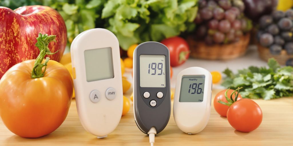 Blood glucose meter with healthy foods in a kitchen.