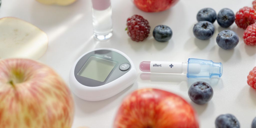 Glucose meter with fruits for diabetes management.